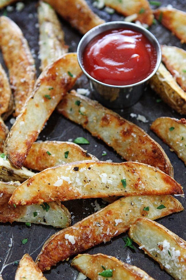 Garlic Parmesan Potato Wedges served with ketchup 