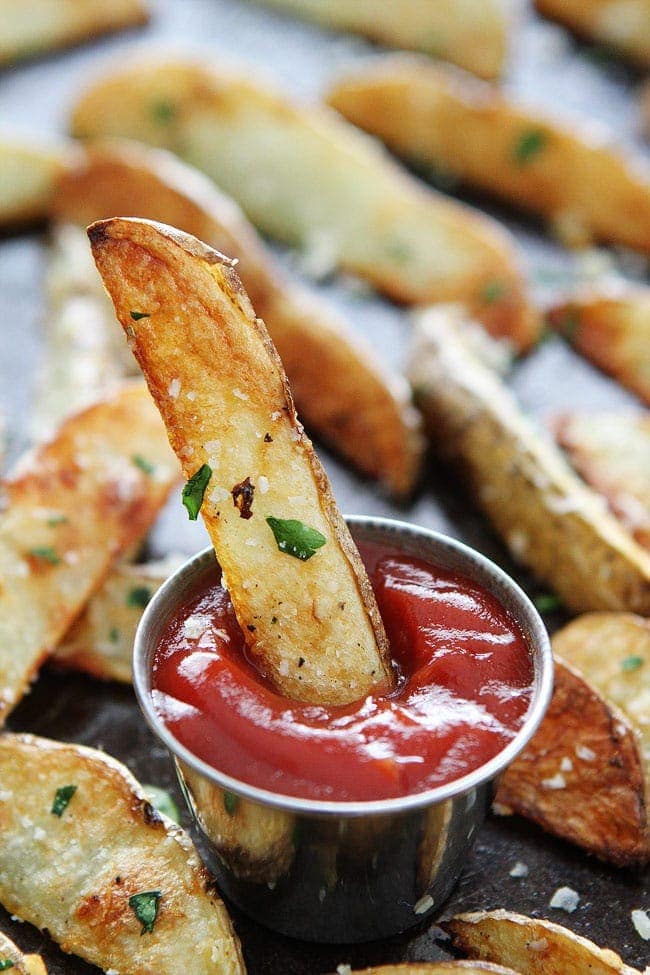 Baked Potato Wedges dipped in ketchup