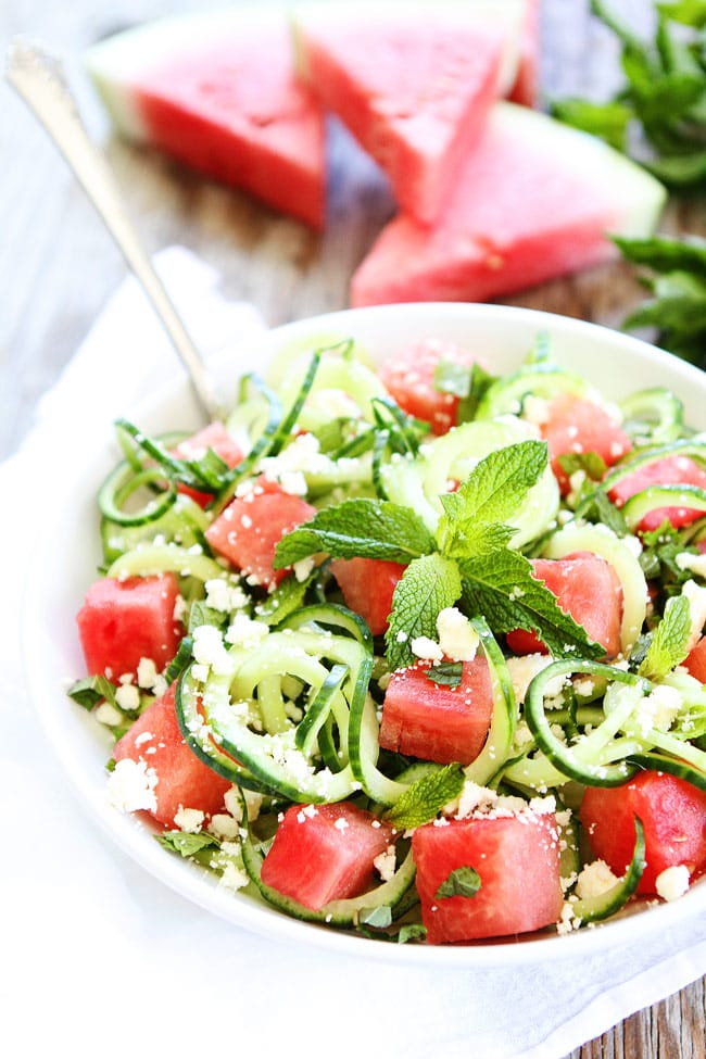 Cucumber Noodle, Watermelon, and Feta Salad Recipe on twopeasandtheirpod.com This easy salad is made with cucumber noodles, watermelon, feta, mint, and fresh lime juice. It is the perfect summer salad! Cucumber Noodle, Watermelon, and Feta Salad Recipe