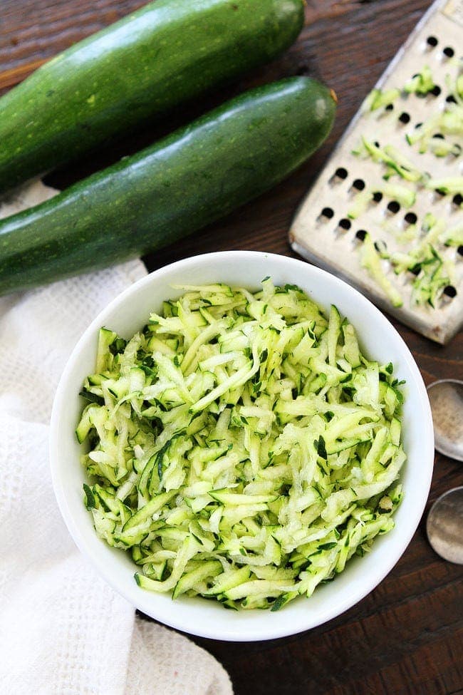 grated zucchini in bowl for zucchini bread.