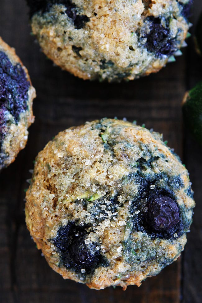Zucchini Banana Blueberry Muffin Recipe on twopeasandtheirpod.com These delicious and healthy whole wheat muffins are made with zucchini, banana, and blueberries! A great way to get your fruits and veggies! Zucchini Banana Blueberry Muffin.