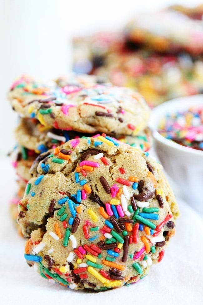Sprinkle Chocolate Chip Cookies Recipe on twopeasandtheirpod.com Chocolate chip cookies covered in bright colored sprinkles. These cookies are so fun! Sprinkle Chocolate Chip Cookies