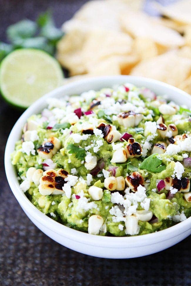 Grilled Corn Guacamole Recipe on twopeasandtheirpod.com You will love this easy guacamole with grilled sweet corn. It is the perfect summer appetizer or snack. Get out the chips and start dipping! Grilled Corn Guacamole Recipe