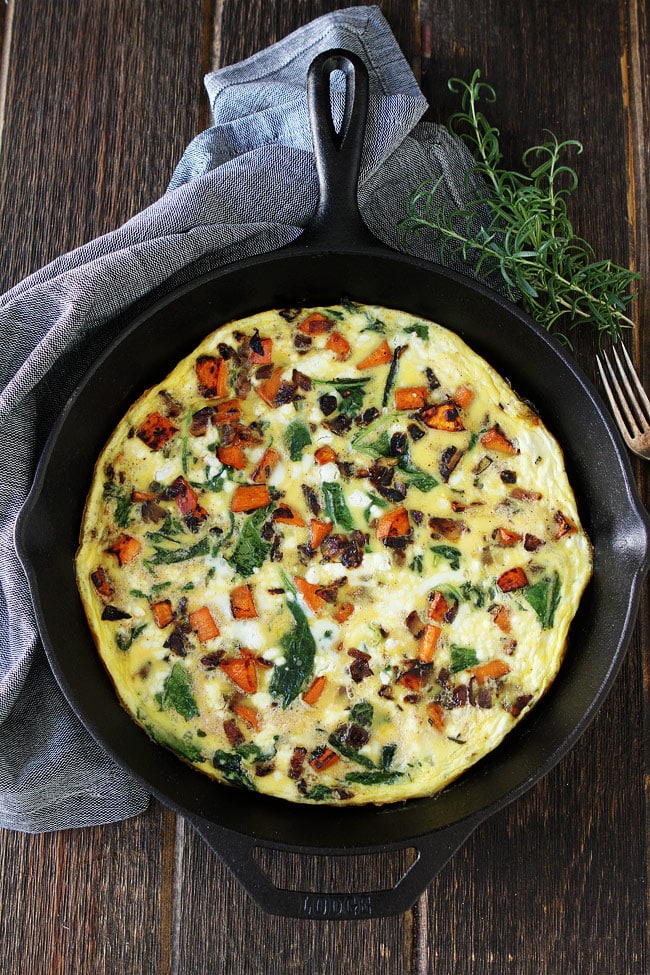Sweet Potato, Kale, and Goat Cheese Frittata in cast iron skillet. 