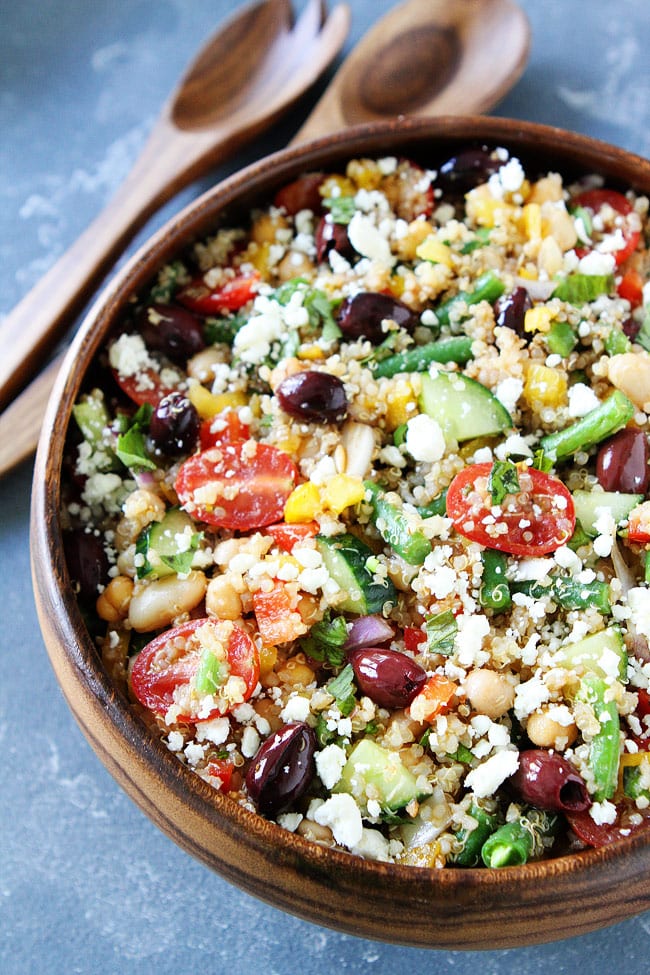 mediterranean quinoa salad ready to serve in wooden bowl