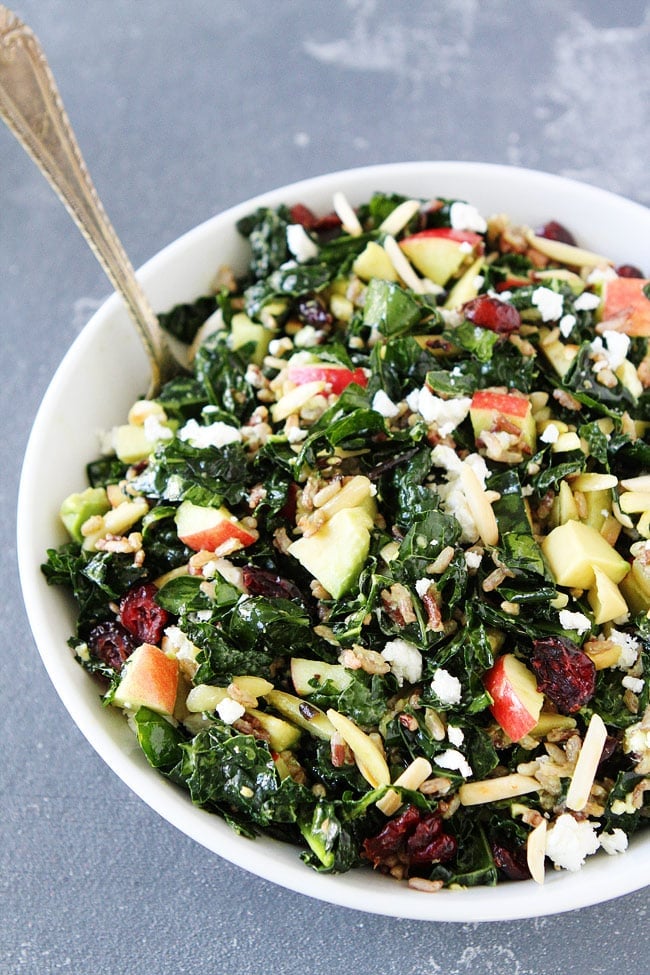 Kale and Wild Rice Salad Recipe on twopeasandtheirpod.com Kale salad with wild rice, apples, avocado, dried cranberries, goat cheese, and almonds. This hearty salad is everyone's favorite! Kale and Wild Rice Salad Recipe