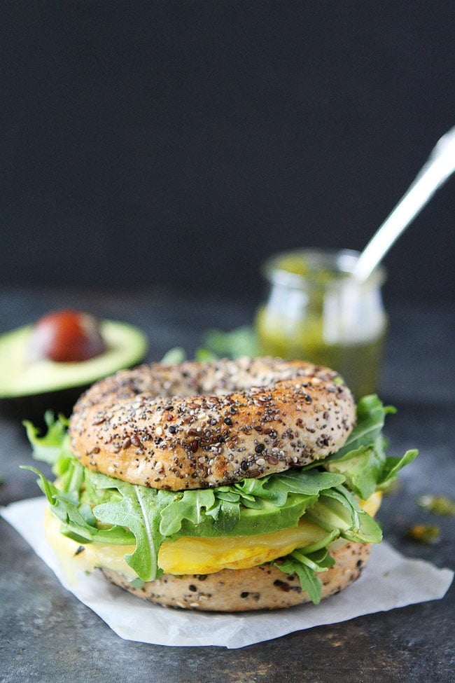 Egg, Avocado, and Pesto Bagel Sandwich with avocado and pesto.