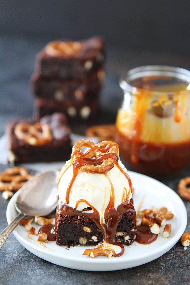 Salted Caramel Pretzel Brownies are fudgy, gooey brownies with pretzel pieces and a layer of salted caramel sauce. Top with vanilla ice cream and extra salted caramel sauce for the most amazing dessert!