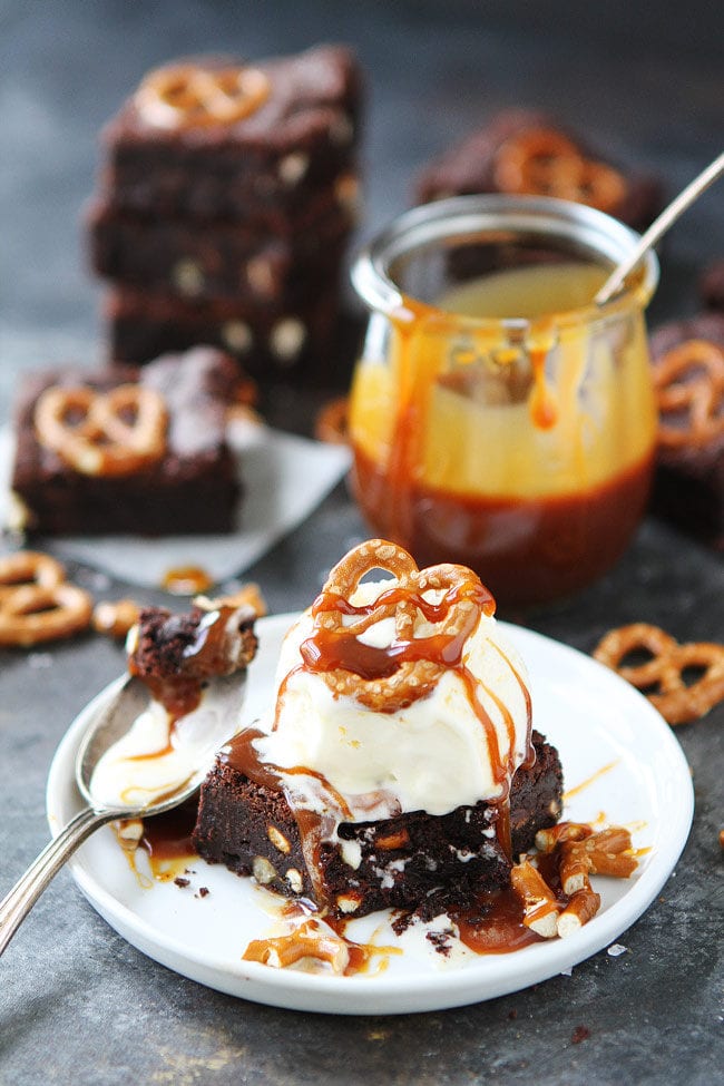 Salted Caramel Pretzel Brownies are fudgy, gooey brownies with pretzel pieces and a layer of salted caramel sauce. This easy brownie recipe is a family favorite dessert!