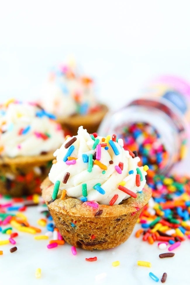 Sprinkle Chocolate Chip Cookie Cups topped with frosting are a fun and delicious dessert for parties, potlucks, or just because! Every day is a good day for cookies with sprinkles! 