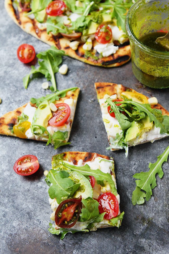 Easy Grilled Flatbread Pizza with burrata, tomatoes, avocado, and basil vinaigrette. A quick and easy summer meal.