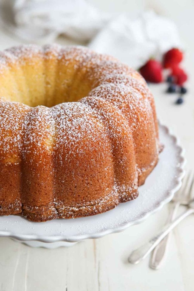 Cream Cheese Pound Cake made in a bundt pan and sprinkled with powdered sugar