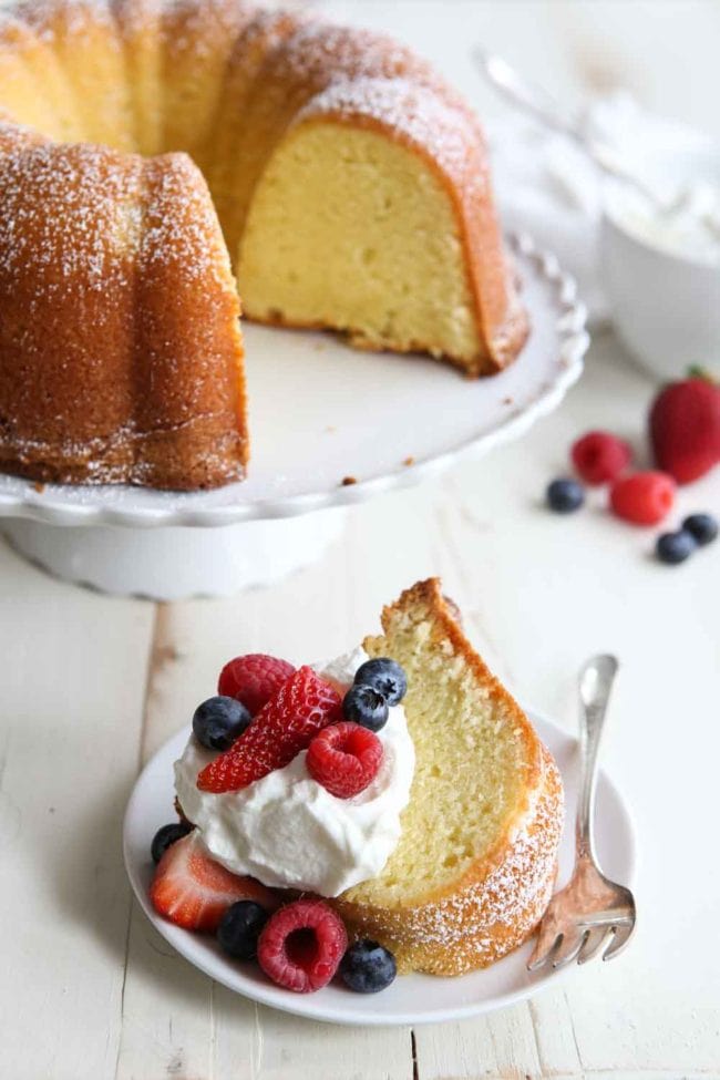 Cream Cheese Pound Cake with berries and whipped cream The perfect dessert for any occasion Best pound cake recipe made with cream cheese