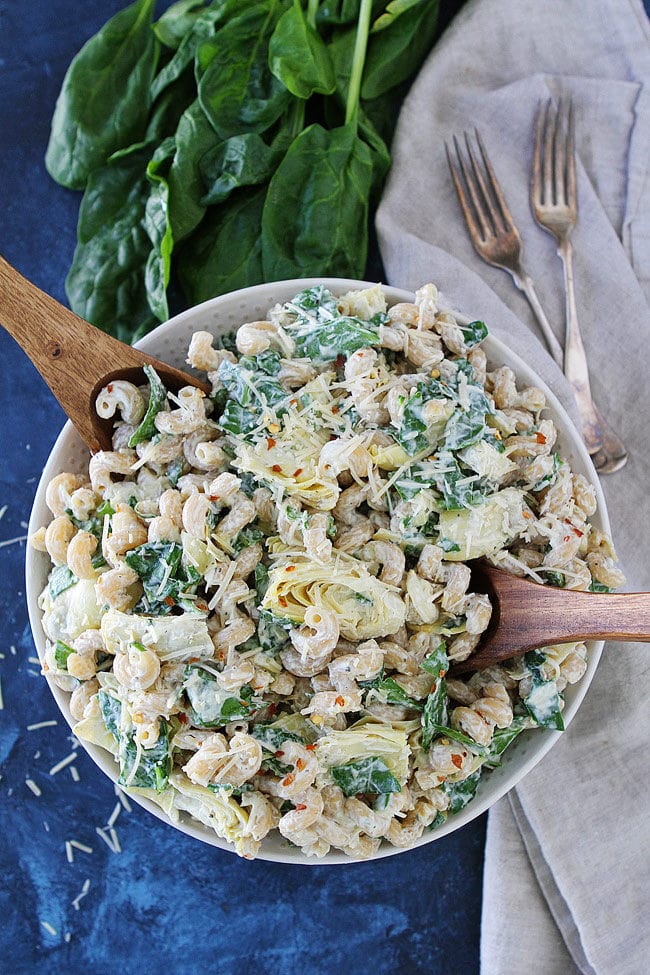 If you like Spinach Artichoke Dip, you will LOVE this easy Spinach Artichoke Pasta Salad! It is a great side dish for parties and potlucks.