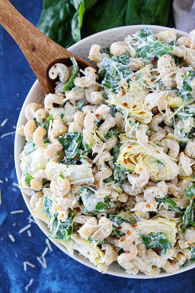 This easy Spinach Artichoke Pasta Salad is always the most popular side dish at parties and potlucks!