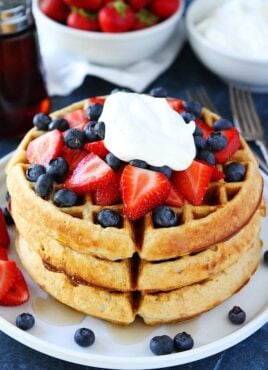 Belgian Waffles stacked with strawberries, blueberries and cream