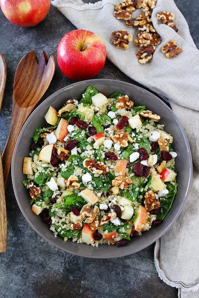 Apple Walnut Quinoa Salad with spinach, dried cranberries, goat cheese, and a simple maple mustard dressing is the perfect salad for fall. #salad #glutenfree