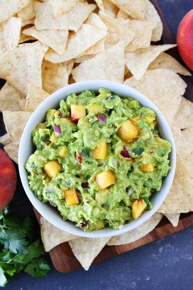 Chipotle Peach Guacamole-easy guacamole recipe jazzed up with fresh peaches and chipotle peppers. This fresh and simple guacamole is the perfect summer appetizer or snack.