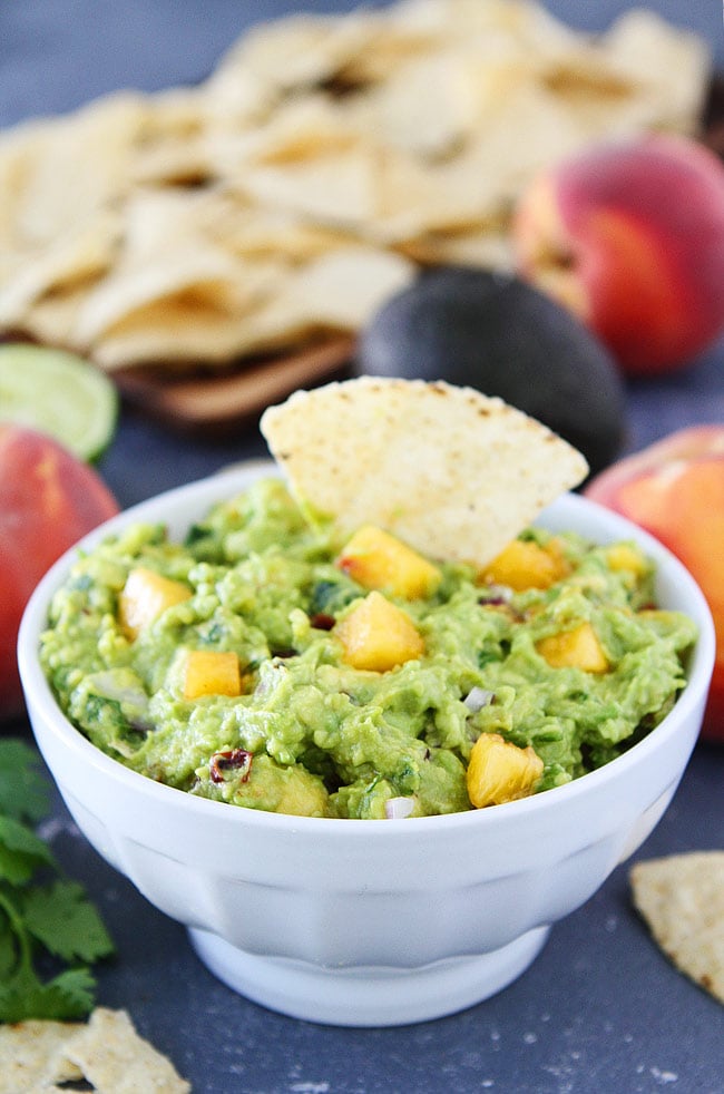 Chipotle Peach Guacamole-easy guacamole recipe jazzed up with fresh peaches and chipotle peppers. This fresh and simple guacamole is the perfect summer appetizer or snack.