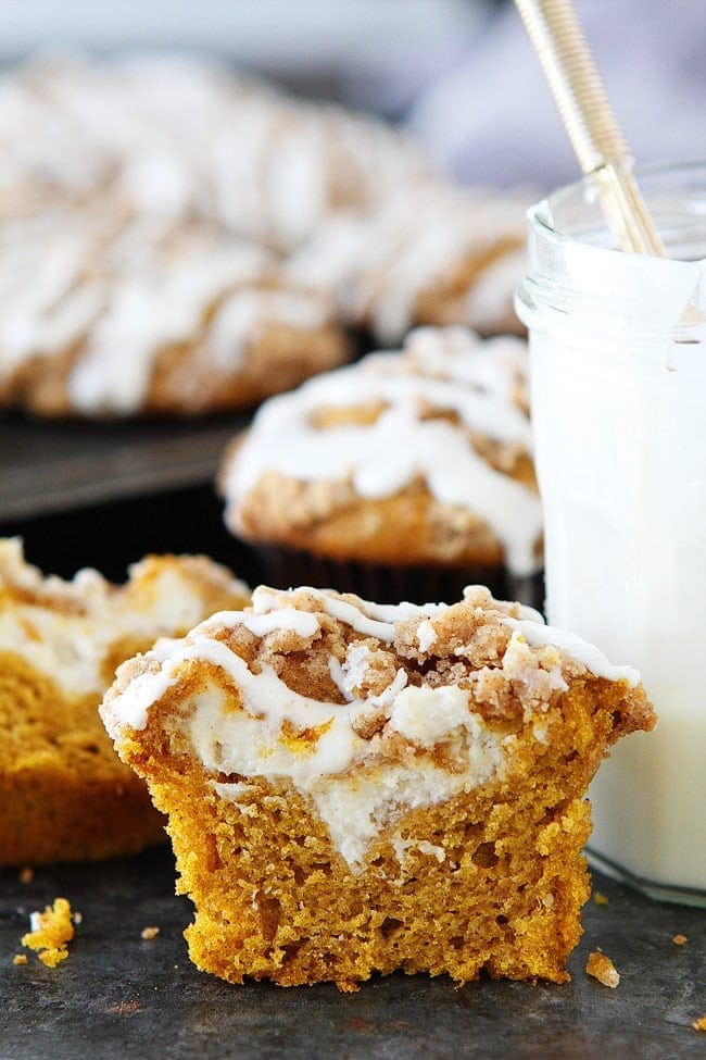 Pumpkin Cream Cheese Muffins with a cream cheese filling, streusel topping, and a sweet cream cheese glaze. The BEST pumpkin muffin recipe EVER!