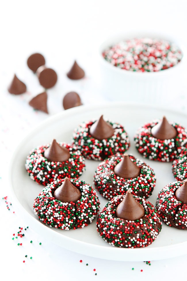 Chocolate Kiss Cookies-decadent chocolate cookies rolled in sprinkles and topped with a chocolate kiss. Always a favorite Christmas cookie! #cookies #chocolate #Christmascookies #holidays #sprinkles