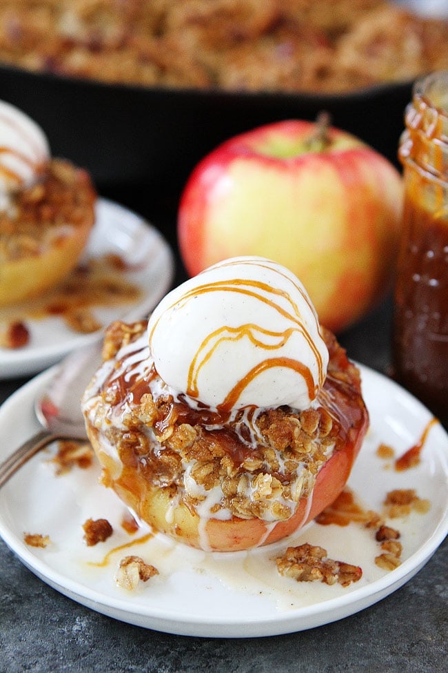 Baked Apples on plate with ice cream and salted caramel sauce