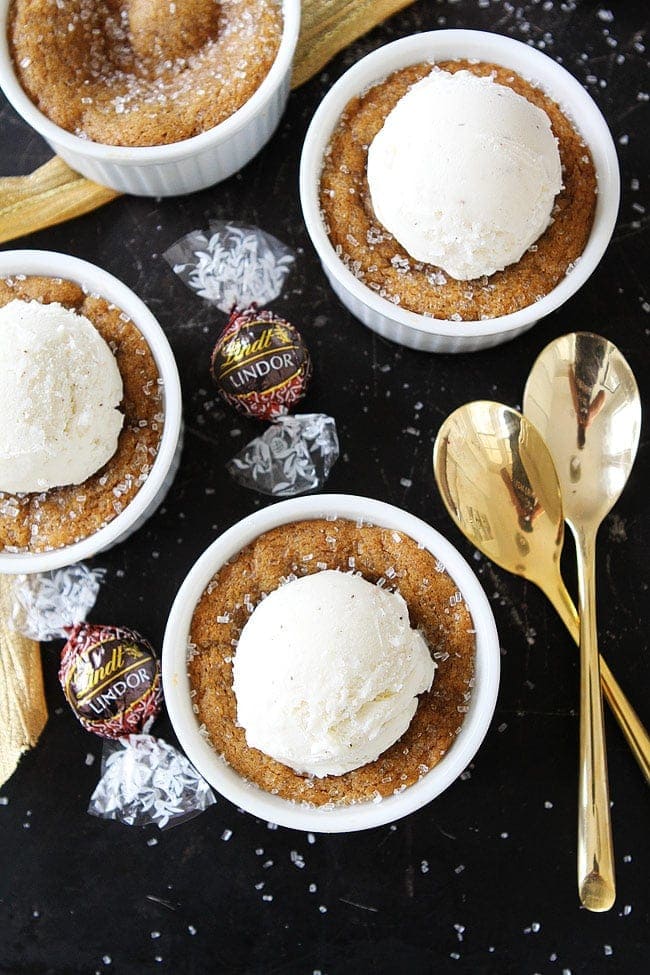 Deep Dish Gingerbread Truffle Cookies-molasses cookies baked in ramekins with a gingerbread milk chocolate truffle inside. Top with ice cream for the perfect holiday dessert! #holidays #gingerbread #dessert #cookies #chocolate