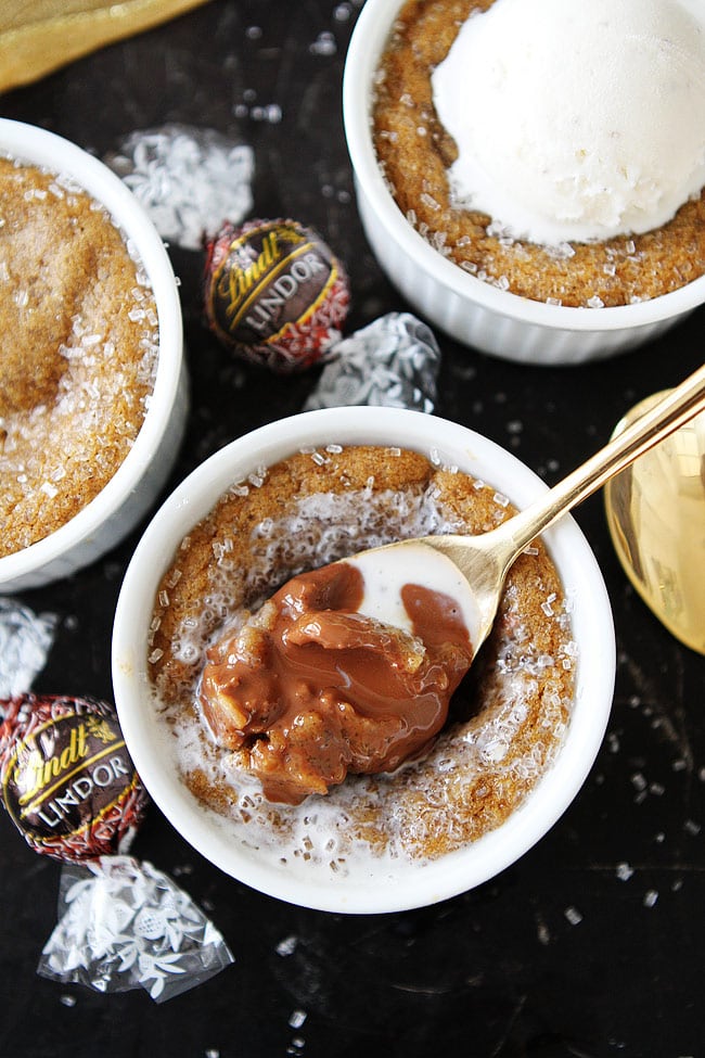 Deep Dish Gingerbread Truffle Cookies-molasses cookies baked in ramekins with a gingerbread milk chocolate truffle inside. Top with ice cream for the perfect Christmas dessert! 