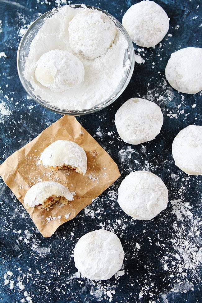 Mexican wedding cookies rolled in powdered sugar. 