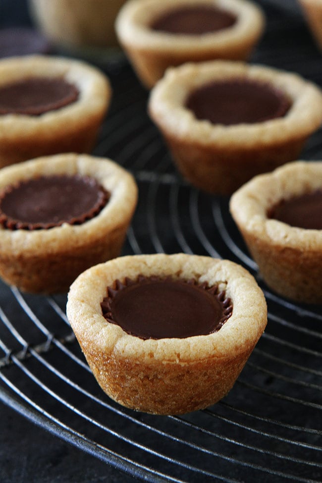 Peanut butter cup cookies on cooling rack. 