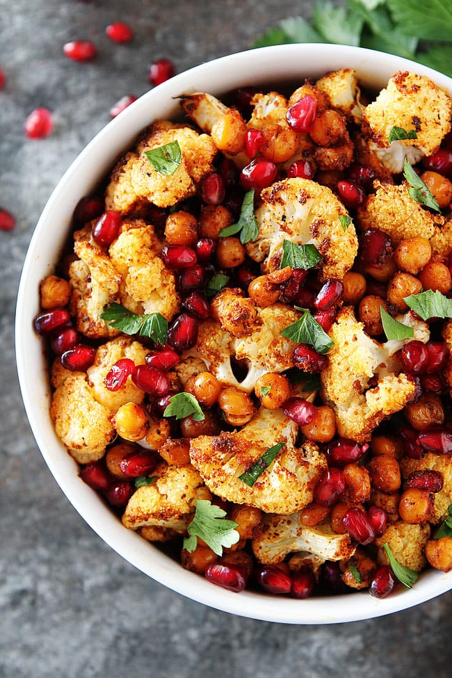 Roasted Cauliflower with Chickpeas and Pomegranate-this easy, healthy side dish is perfect for Thanksgiving and Christmas. #holidays #vegan #glutenfree #Thanksgiving #Christmas #cauliflower #chickpeas