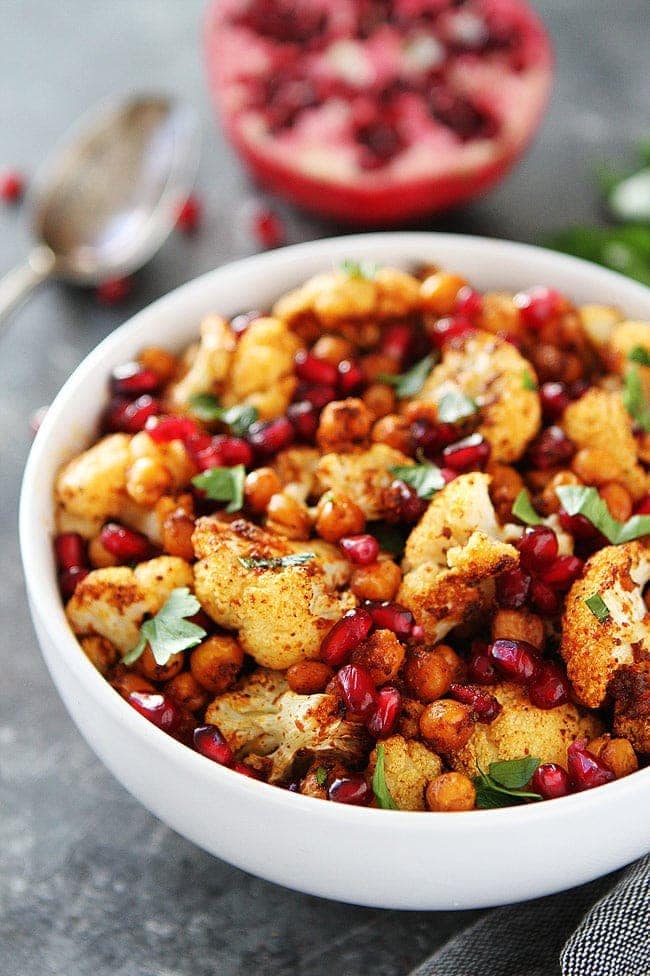 Roasted Cauliflower with Chickpeas and Pomegranate-this easy, healthy side dish is perfect for the holidays or any day! #cauliflower #chickpeas #vegan #glutenfree #holidays