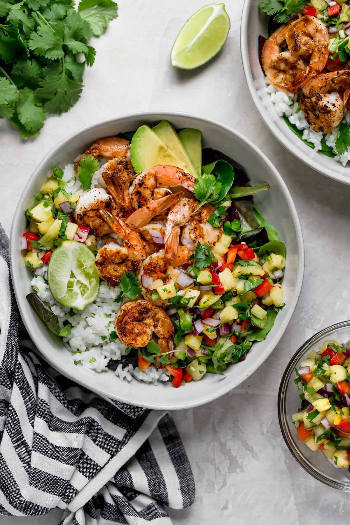 Shrimp Bowls with coconut lime rice, pineapple salsa, cilantro, and lime. 