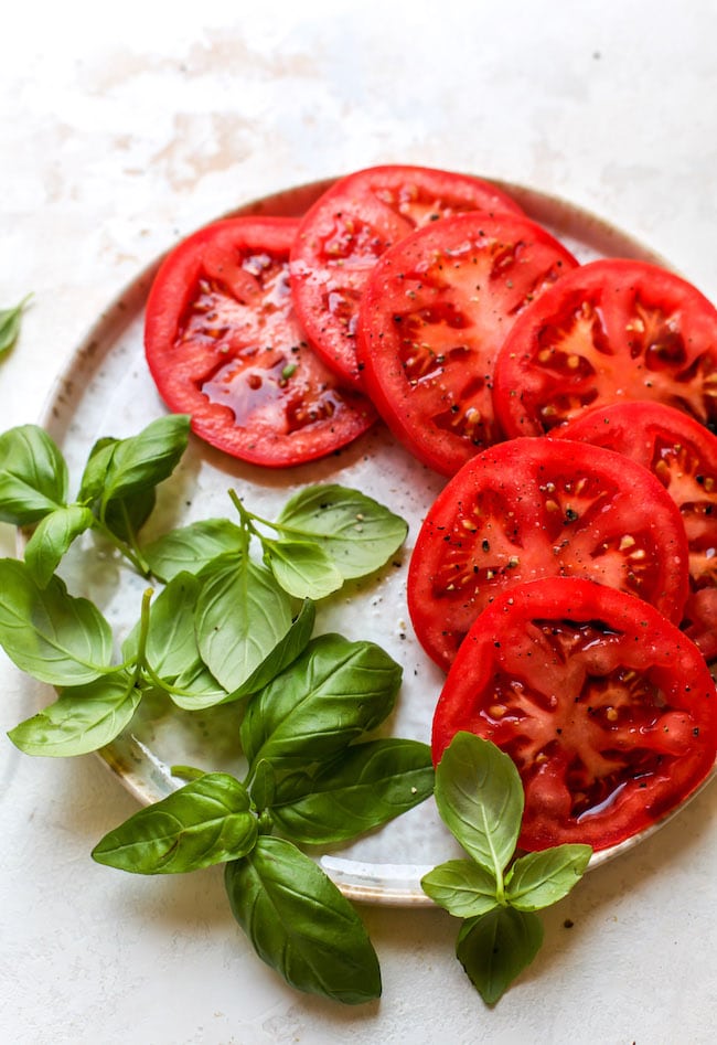 Caprese Eggs Benedict with tomatoes and basil