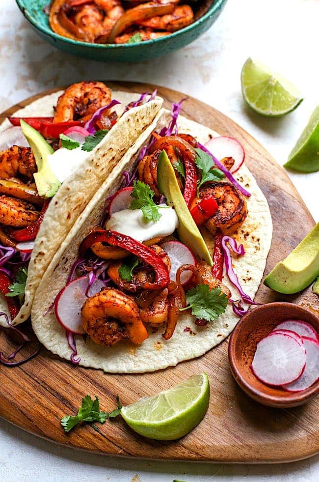 https://www.twopeasandtheirpod.com/wp-content/uploads/2019/04/Shrimp-Fajitas-3.jpg