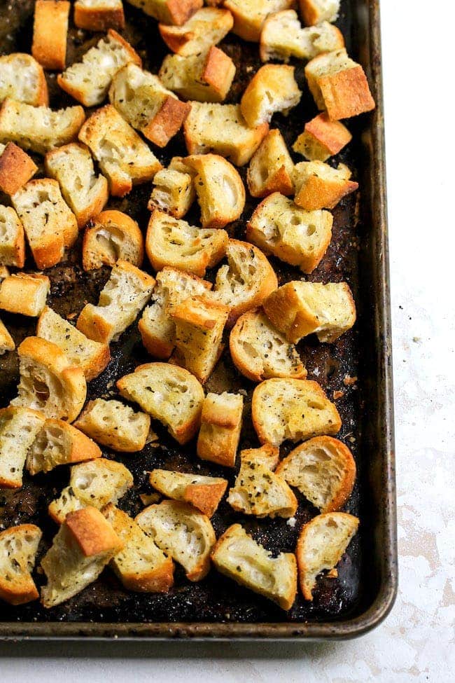 homemade croutons on baking sheet.