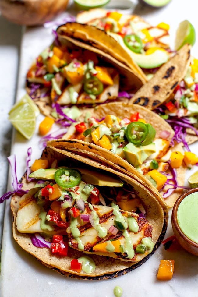 Grilled Halloumi Tacos with mango salsa on platter. 