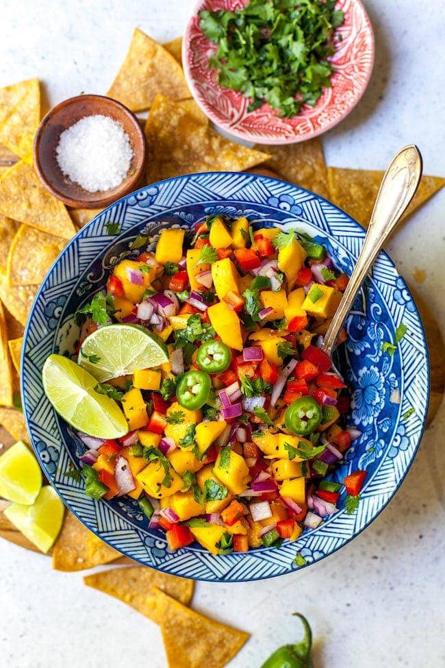 Mango Salsa in bowl with spoon.