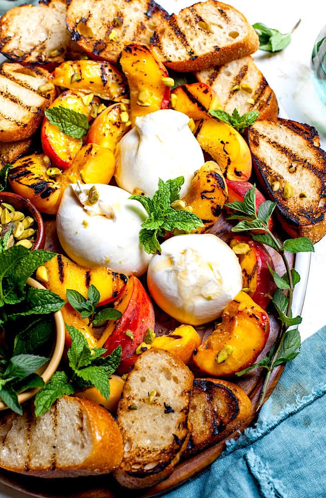 Grilled Peaches with Burrata, Honey, Pistachios, and Mint