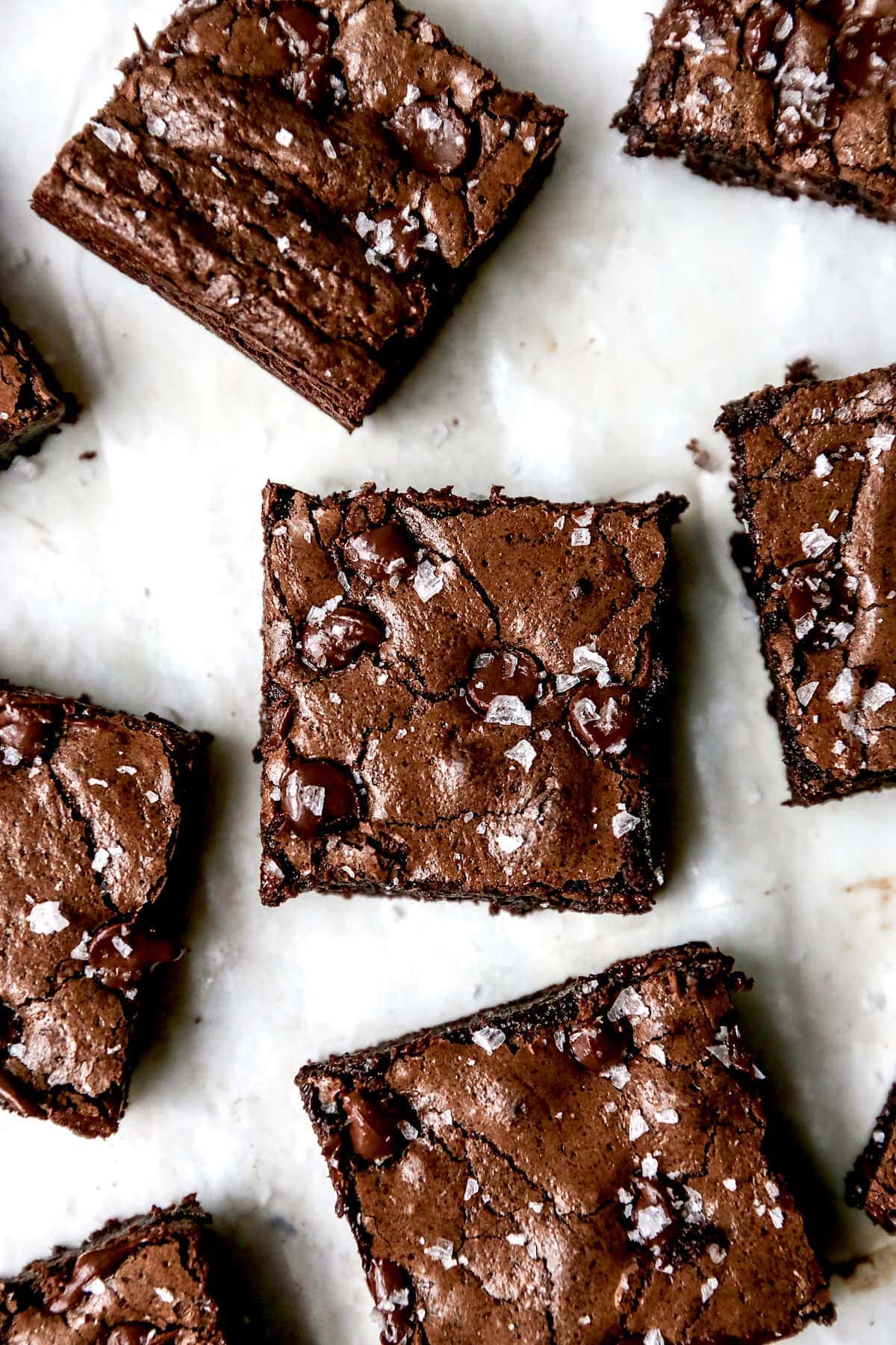 Gluten Free Brownies cut into squares with flaky sea salt. 