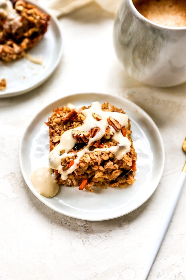 Carrot Cake Baked Oatmeal on plate with cream cheese glaze