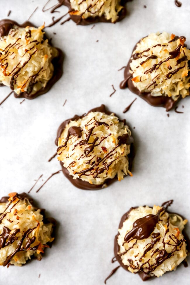 Coconut macaroons dipped in chocolate and drizzled with chocolate