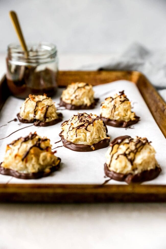 Coconut Macaroons with chocolate on baking sheet