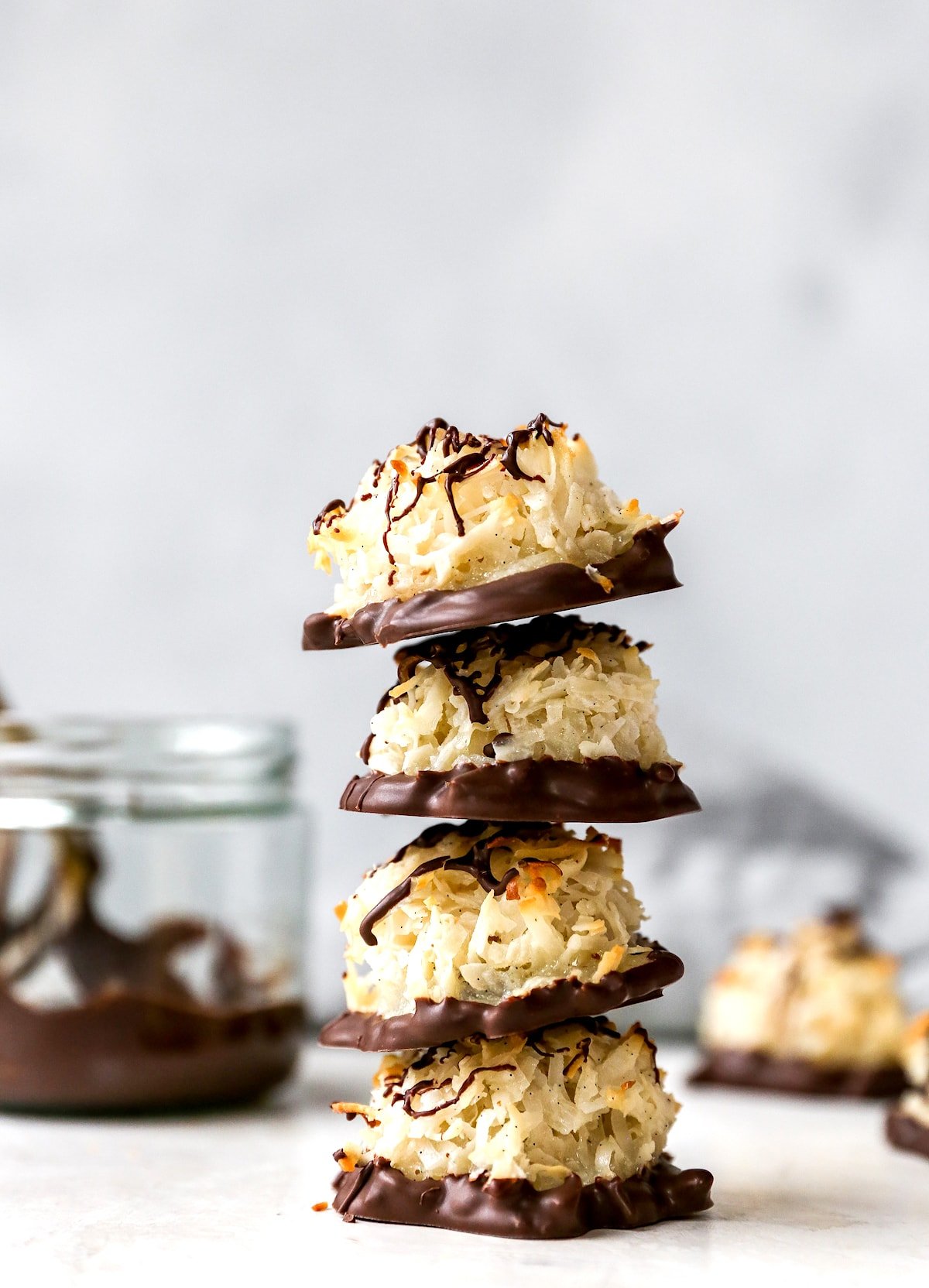 stack of Coconut Macaroons dipped in chocolate.