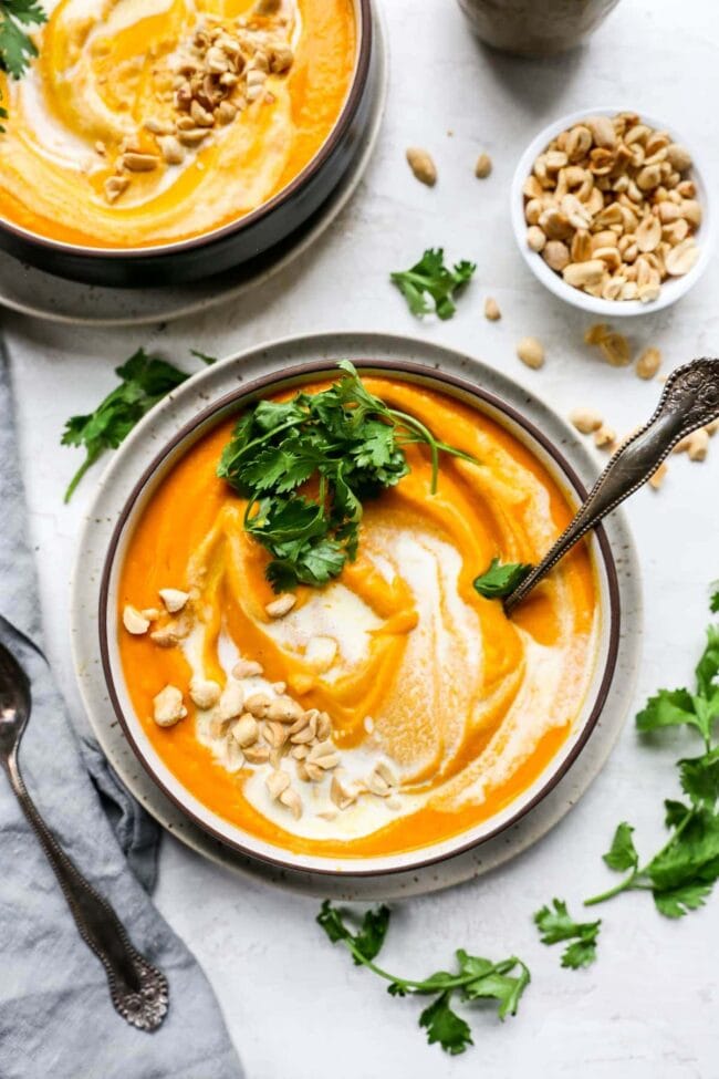 Roasted Carrot Ginger Soup in bowl with spoon