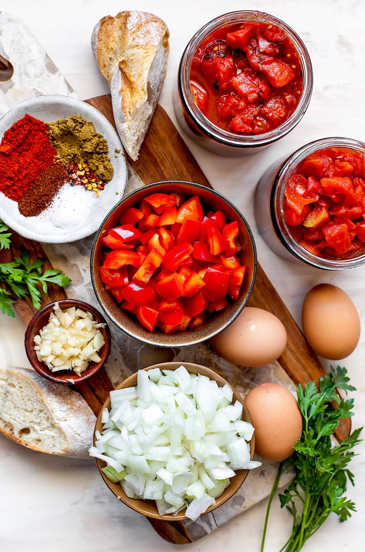 ingredients on cutting board to make shakshuka. 