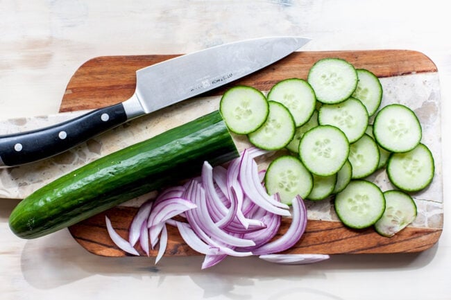 Cucumber Salad ingredients on cutting board