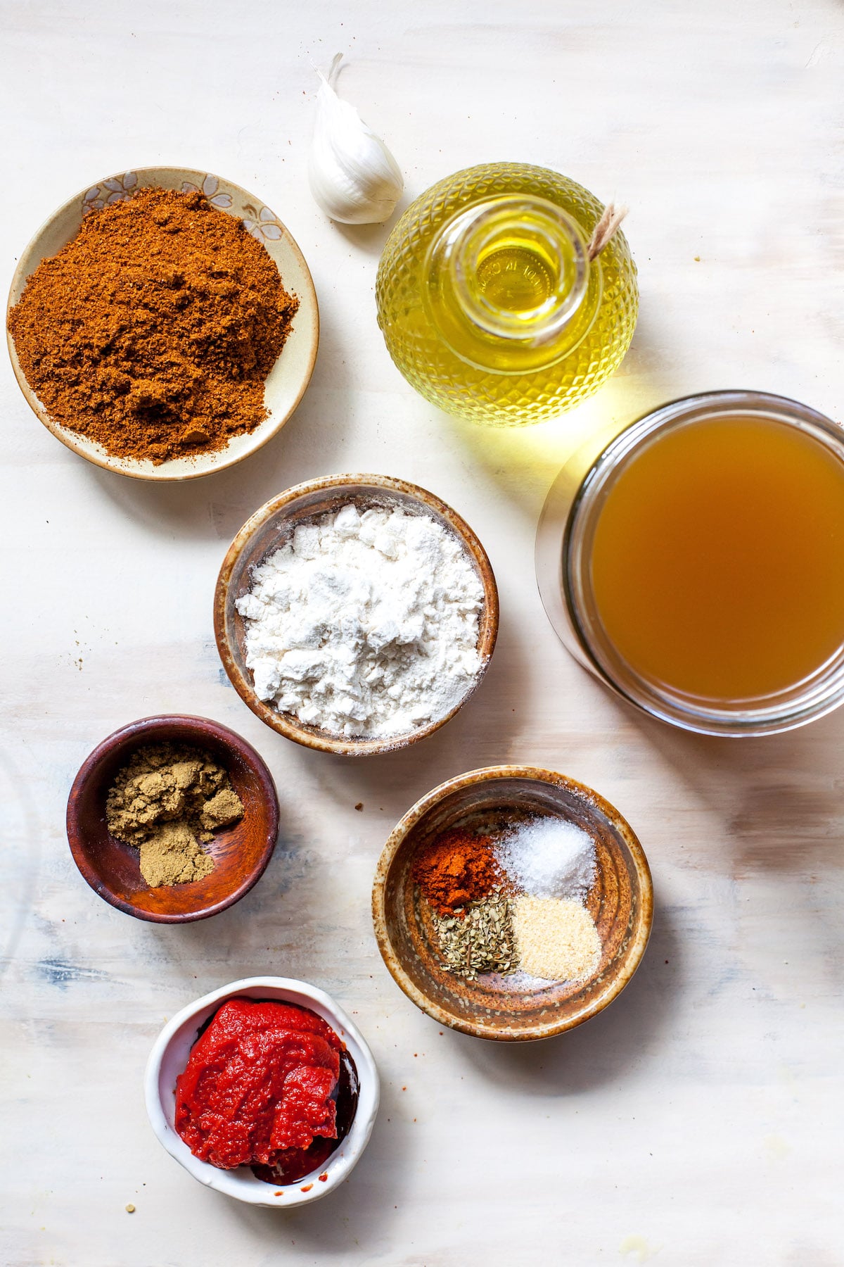 enchilada sauce ingredients in bowls.