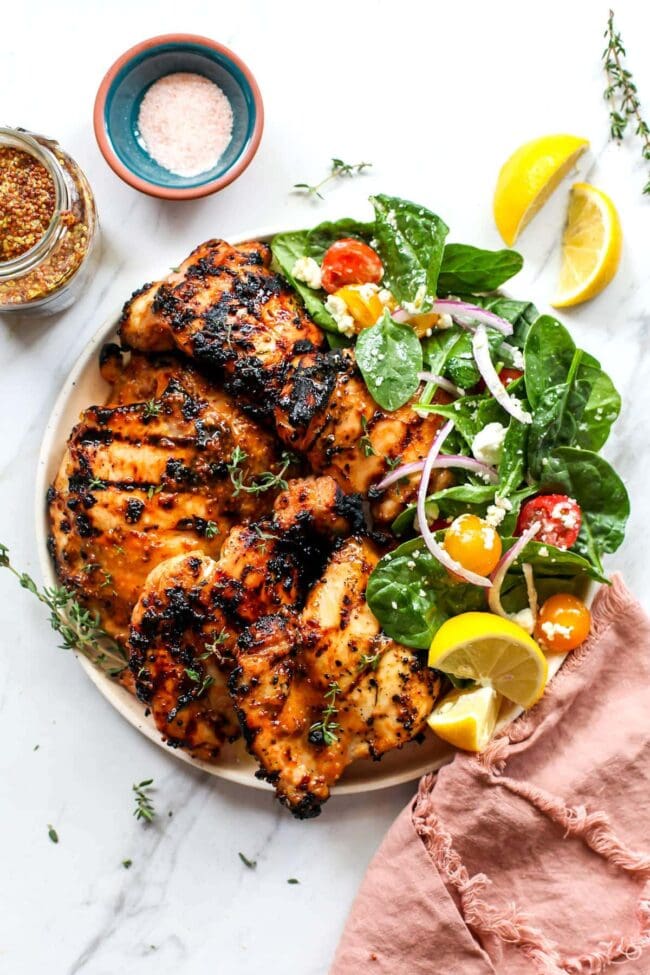 Honey mustard chicken on plate with salad