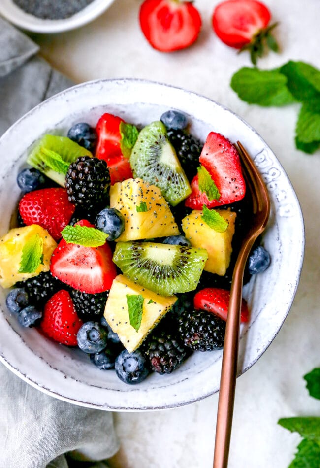 fruit salad with fork in a bowl